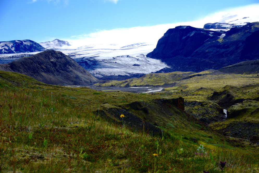 White Mýrdalsjökull glacier in the middle of a green landscape